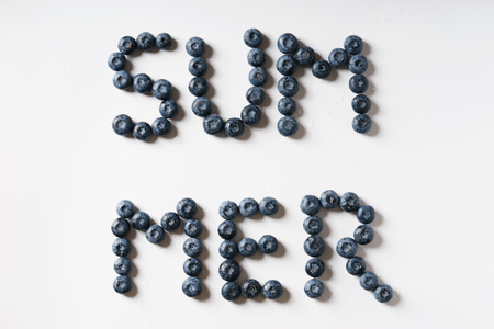 the word summer in blueberry font, on white backgroundの写真素材