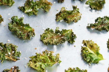 Homemade green kale chips with white sesameの写真素材