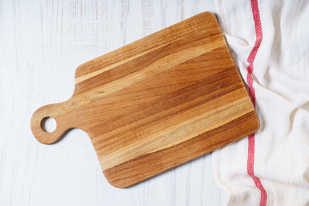 Empty wooden cutting board, cooking concept. top view.の写真素材