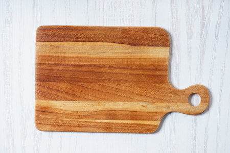Empty wooden cutting board, cooking concept. top view.の写真素材
