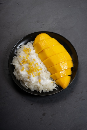 mango and sticky rice with coconut milk, traditional Thai dessertの写真素材
