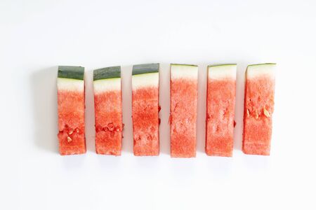 Fresh watermelon slices in a rectangle on white backgroundの写真素材