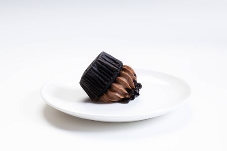 Chocolate cupcake fallen on whiteの写真素材