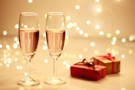 Glass of champagne on blur lightsの写真素材