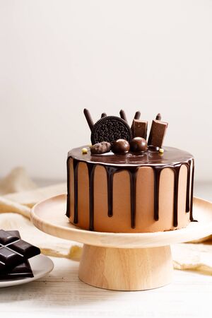 Tasty dark chocolate cake on wooden tableの写真素材