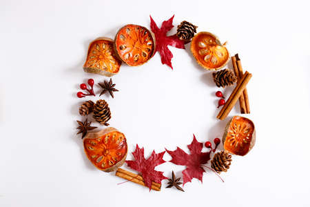 Autumn flat lay composition with autumn dried fruits and leaves on white background.の写真素材