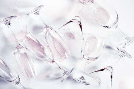 Glasses of champagne and alcohol drinks on white table background, Celebration concept. Top view.の写真素材