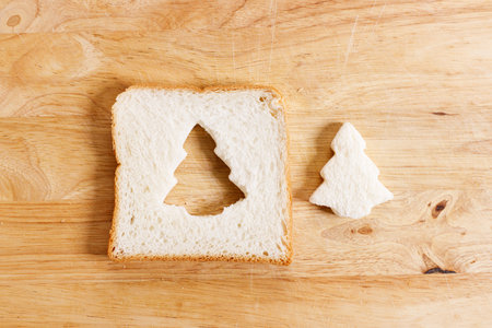 white bread sliced, cut to christmas tree shape. Christmas decoration concept.の写真素材
