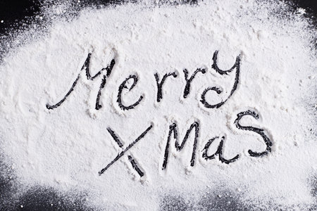 Merry Christmas, handwriting, on flour background. top view.の写真素材