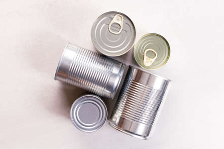 Different kinds of vegetables in cans on kitchen table background.の写真素材
