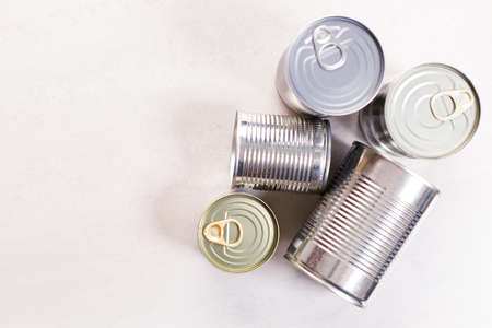 Different kinds of vegetables in cans on kitchen table background.の写真素材