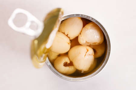 Open tin can of red bean on kitchen table background. top view.の写真素材