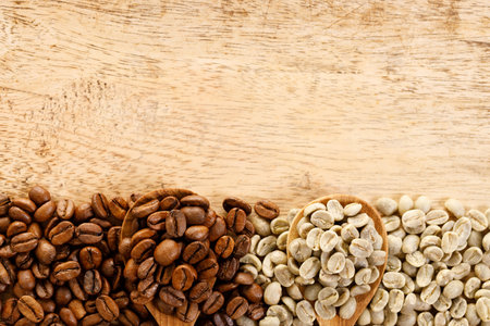 roasted coffee beans and unroasted green coffee beans on wooden background, top view with coffee space.の写真素材