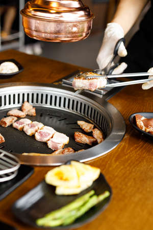 Korean style pork barbecue with vegetable side dishの写真素材
