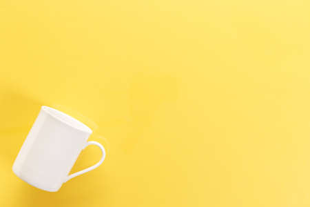 White cup on the tableの写真素材