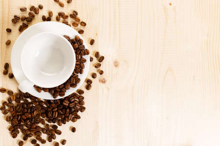 Cup of black coffee with coffee beansの写真素材