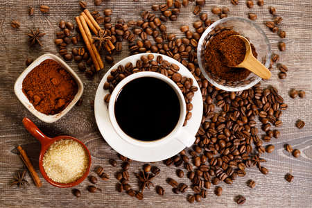 Cup of black coffee with coffee beansの写真素材