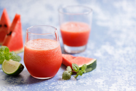 Watermelon smoothies with fresh green lime for summer drinks concept.の写真素材