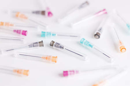Pile of medical syringes on white background, closeup.の写真素材