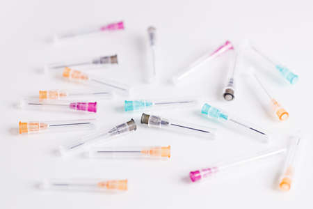 Pile of medical syringes on white background, closeup.の写真素材