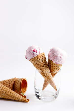 sweet ice cream made of strawberry in cones on white backgroundの写真素材