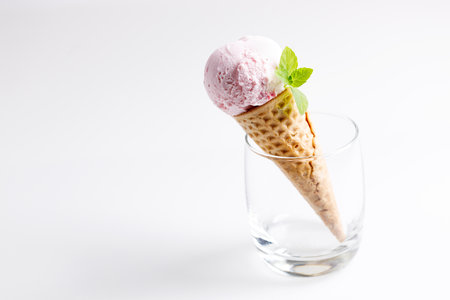 sweet ice cream made of strawberry in cones on white backgroundの写真素材
