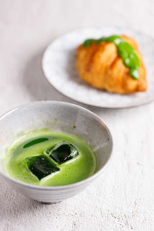 Organic matcha green tea drink in traditional bowlの写真素材
