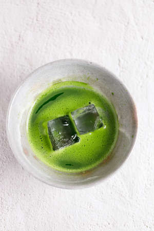 Organic matcha green tea drink in traditional bowlの写真素材