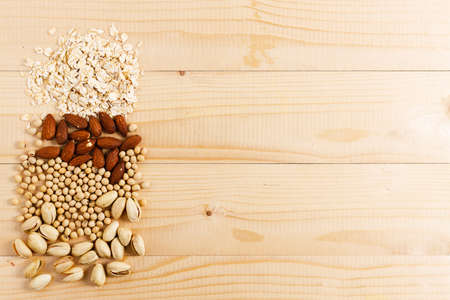 Various vegan plant based milk ingredients on wooden table. top view.の写真素材