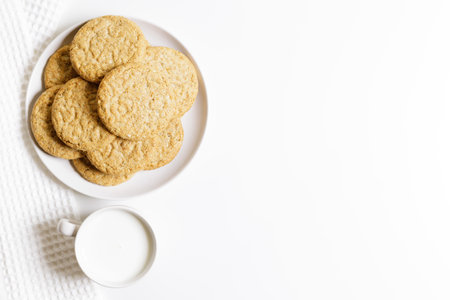 Oatmeal cookies on white plate. Healthy round cookies. Top view.の写真素材