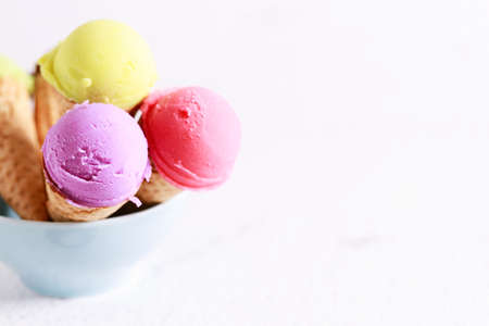 variety of ice cream scoops with waffle cones, closeup.の写真素材