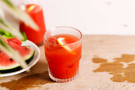 Watermelon juice in a glass with fresh slice of watermelon.の写真素材