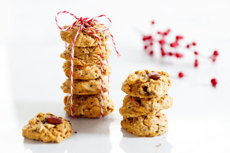 Oatmeal cookies with black sesame and almond, healthy low- calorie sweet snack, on white background.の写真素材