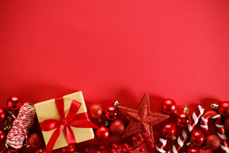 New year background with red ornament decorations on red background. Christmas and New Year background with copy space.の写真素材