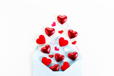 Valentine day concept. Envelope and red hearts on white background. Decorations for Valentineâs day.の写真素材