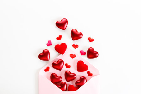Valentine day concept. Envelope and red hearts on white background. Decorations for Valentineâs day.の写真素材