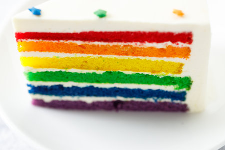 Piece of cake with rainbow colored. Closeup. Pride month concept. Rainbow love concept.の写真素材