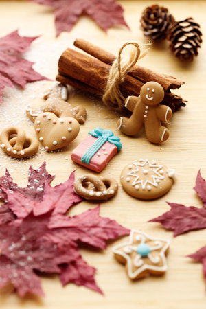 Assorted gingerbread cookies decorated icing with autumn stuff on wooden table background.の写真素材