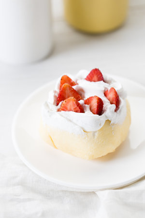 Homemade Crepe cake topped with fresh cream and strawberries. Closeup.の写真素材