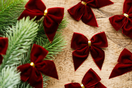 Red ribbons with pine branches, Christmas tree concept. Closeup.の写真素材