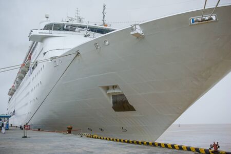 Looking up at large cruise ship in portの写真素材