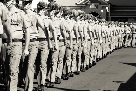 Charters Towers, Australia April 25, 2015: Anzac Day Parade with soldiers marching down main street of town.のeditorial素材