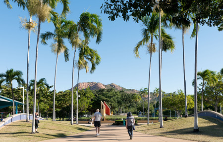 Townsville, Australia - August 4, 2016: People enjoying time on The Strand, Townsville with iconic Castle Hill in the background.のeditorial素材