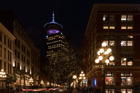 Vancouver, Canada - January 28, 2017: Gastown, Vancouver at night with the steam clock and Vancouver Lookout in the backgroundのeditorial素材
