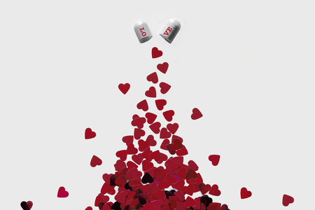 Capsule full of red hearts conceptの写真素材