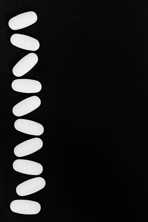 Many pills or medication lined up or fallingの写真素材