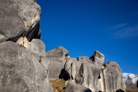 Tall limestone rock formations form an impressive castle like fortress in the valley at Castle Hillの写真素材