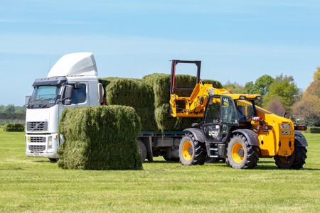 Geraldine, Canterbury, New Zealand - October 21 2018: A truck is loaded up with fresh hay bales on a...