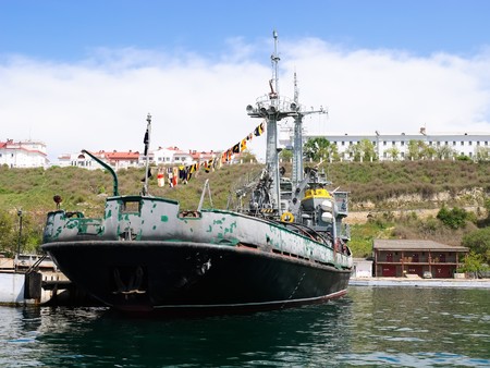 old rusty fire ship moored in the port dock の写真素材