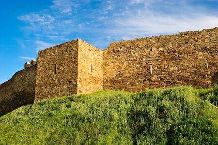 VII century Genoese fortress. Stone wall and tower.の写真素材